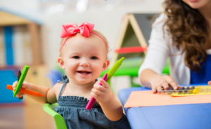 Baby Girl Holding Toy | CovenantSchool